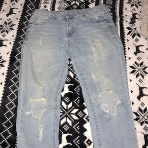 ripped jeans in front. light blue jeans